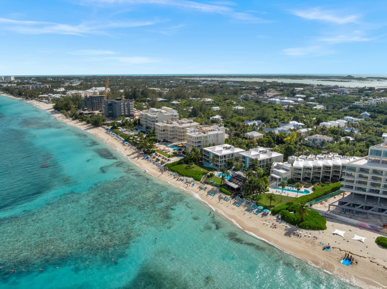Aerial view of the Bight Reef coral patches and marker buoys along the beach at Coral Gardens on Grace Bay